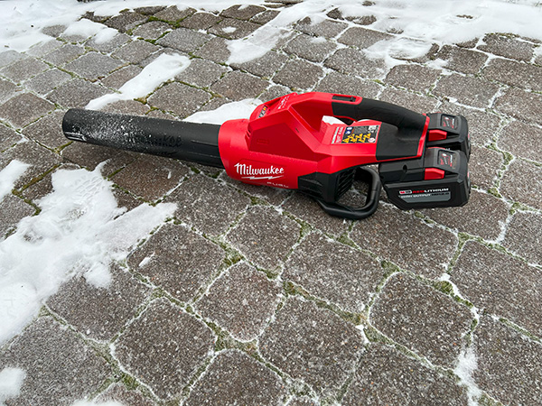 Milwaukee M18 Fuel Dual Battery Cordless Blower on Snowy Paver Stones